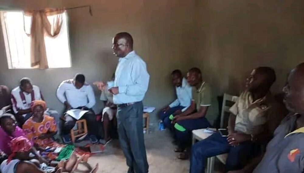 Owen Dhliwayo with community members who face eviction before they head into a training on land rights in Chipinge district, Zimbabwe.