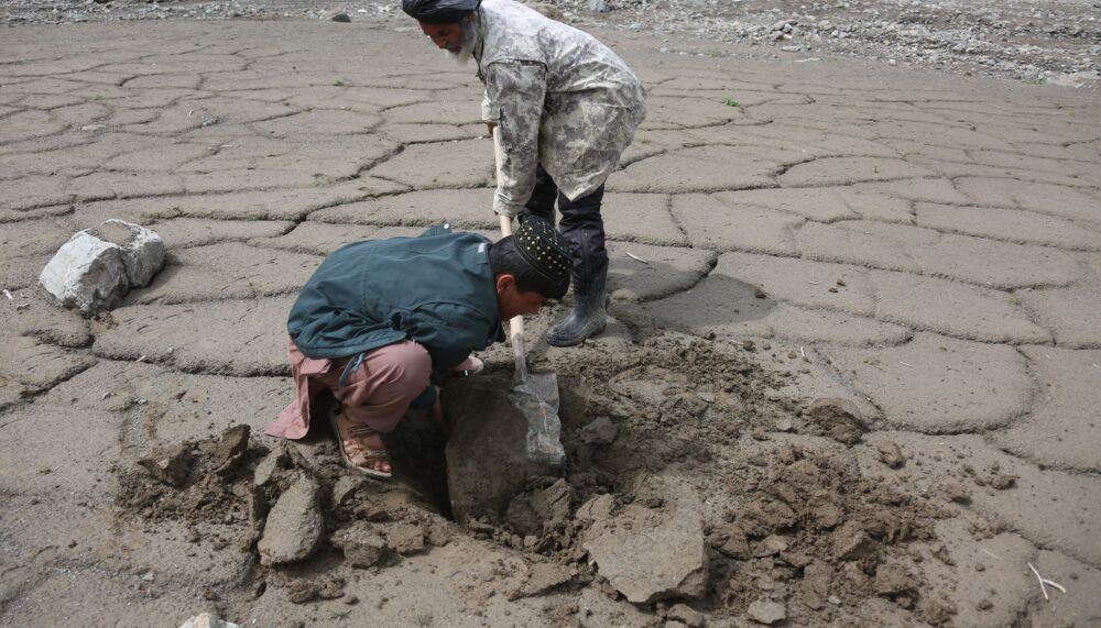 BAGHLAN, April 22, 2025 (Xinhua) -- Farmers work on agricultural land affected by recent floods in Burka district in northern Baghlan province, Afghanistan, April 20, 2025. TO GO WITH "Feature: Afghans at the crossroads of climate crisis, deepening poverty" (Photo by Saifurahman Safi/Xinhua)