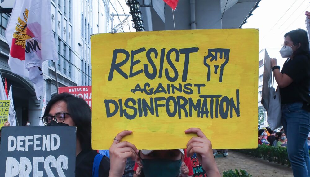 October 8, 2022, Manila, Philippines: Militant protesters hold placards with a message ''Defend Press Freedom'' and ''Resist against Disinformation'' during the demonstration. Militant groups staged a protest in Manila in connection with Ferdinand Marcos Jr. 100 days in power as Philippine President.