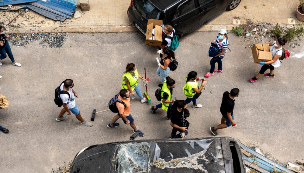 Volunteers clean the streets and distribute food near the site of the explosion, on the 3rd day after a huge unknown blast at the port of Beirut, Lebanon on August 7, 2020.